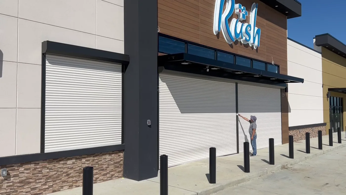 Same storefront with shutters lowered